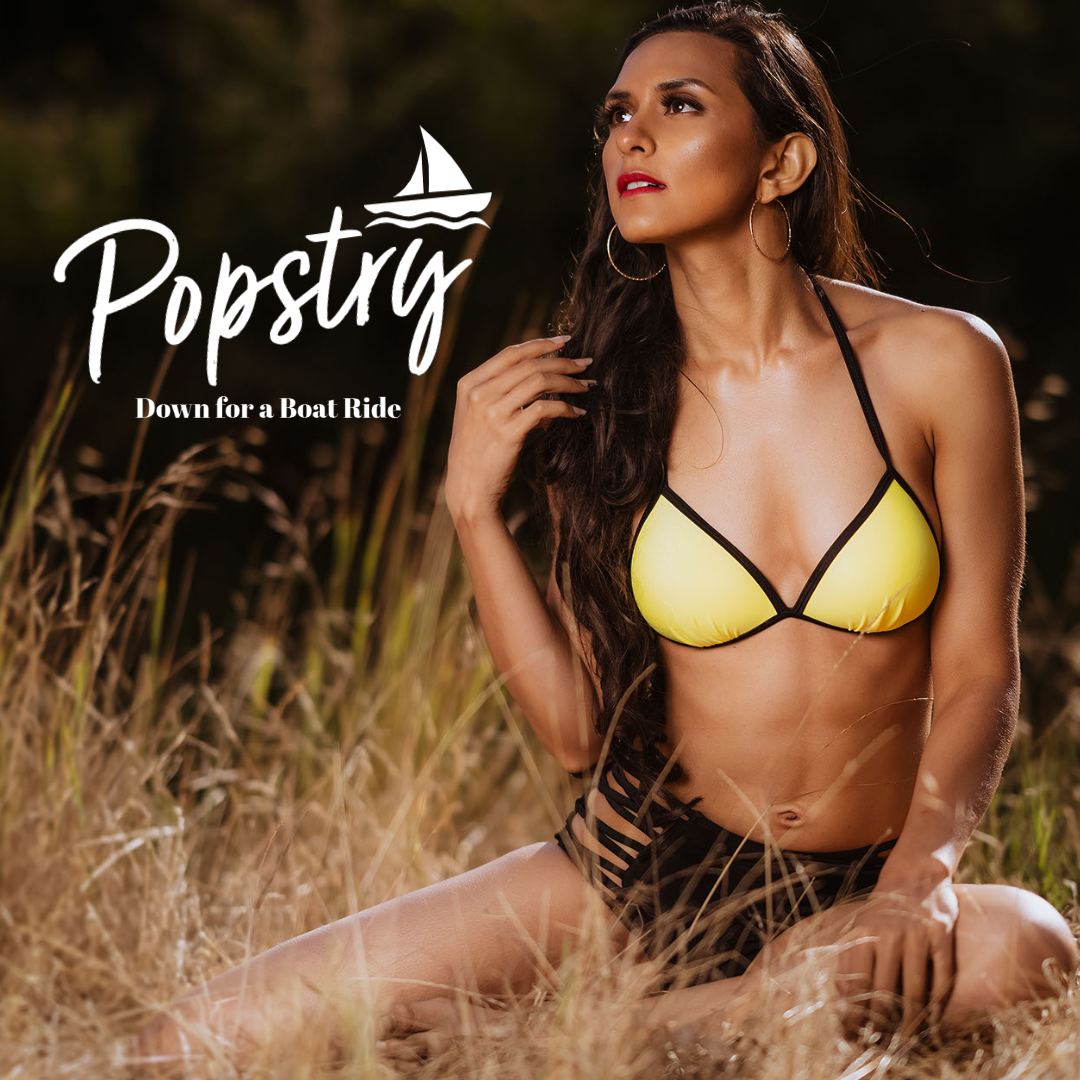 Indian Swimwear Model Aakriti Sachdev wearing sporty yellow bikini, sitting on the grass