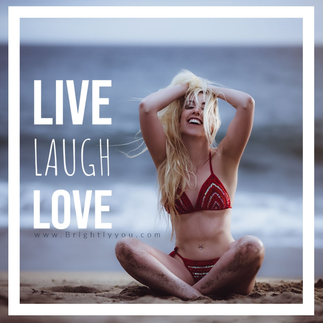 Blonde bikini model laughing by the ocean  in red bikini - Live Laugh Love