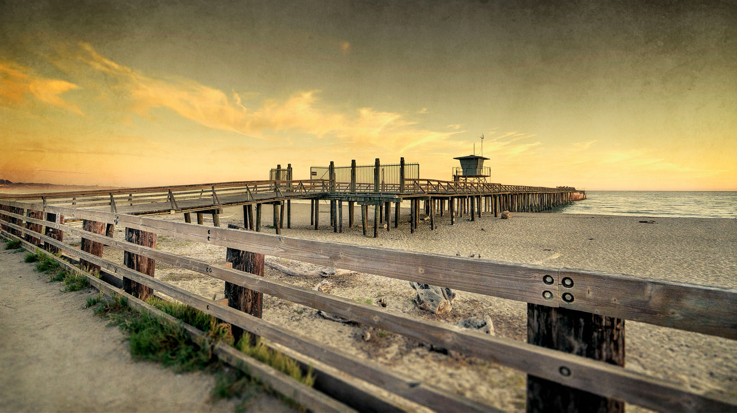 a wooden fence and a pier